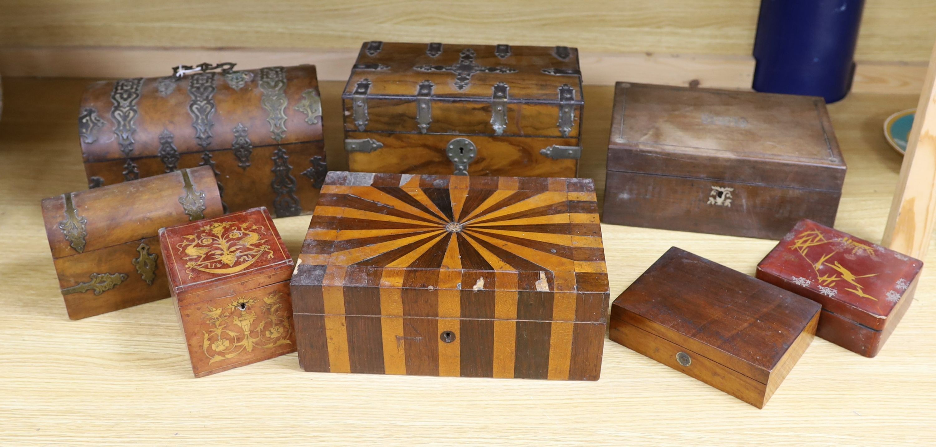 A Victorian Walnut and brass strap mounted tea caddy together with two caskets and five other boxes (8)